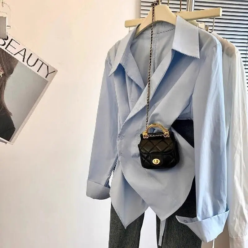 Designer's irregular long sleeved lapel shirt for women, waist cinching white, minimalist style basic top for women's shirt