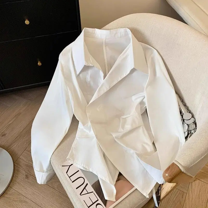 Designer's irregular long sleeved lapel shirt for women, waist cinching white, minimalist style basic top for women's shirt