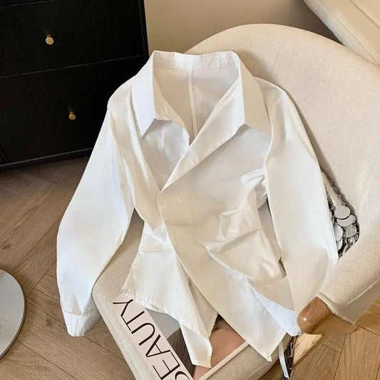 Designer's irregular long sleeved lapel shirt for women, waist cinching white, minimalist style basic top for women's shirt